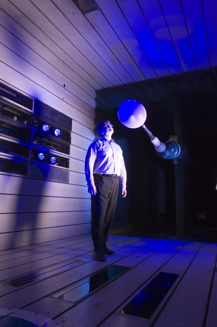 CEV model with pressure sensitive paint (PSP) test 11-0148 in the 11ft Ames wind tunnel. Joe Olejniczak with blue LEDS.