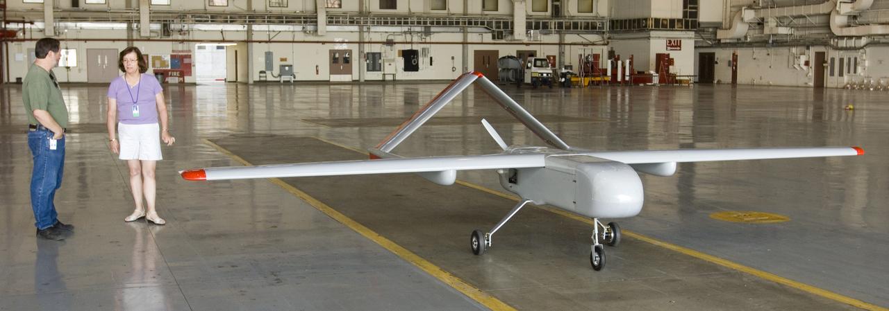 Sierra Uninhaited Aerial System (UAV plane) in the Ames hangar. aks; Sierra Unpiloted Aerial system (UAS) with L-R: Larry Pezzolo and Leslie Monforton, Naval Research Lab (on detail)