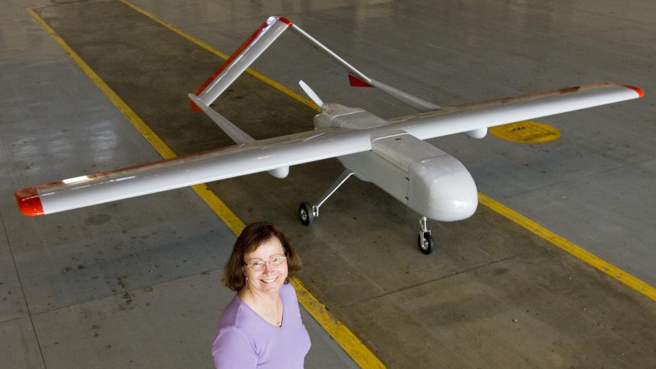 Sierra Uninhaited Aerial System (UAV plane) in the Ames hangar. aks; Sierra Unpiloted Aerial system (UAS) with Leslie Monforton (on detail from the Naval Reesearch Lab)