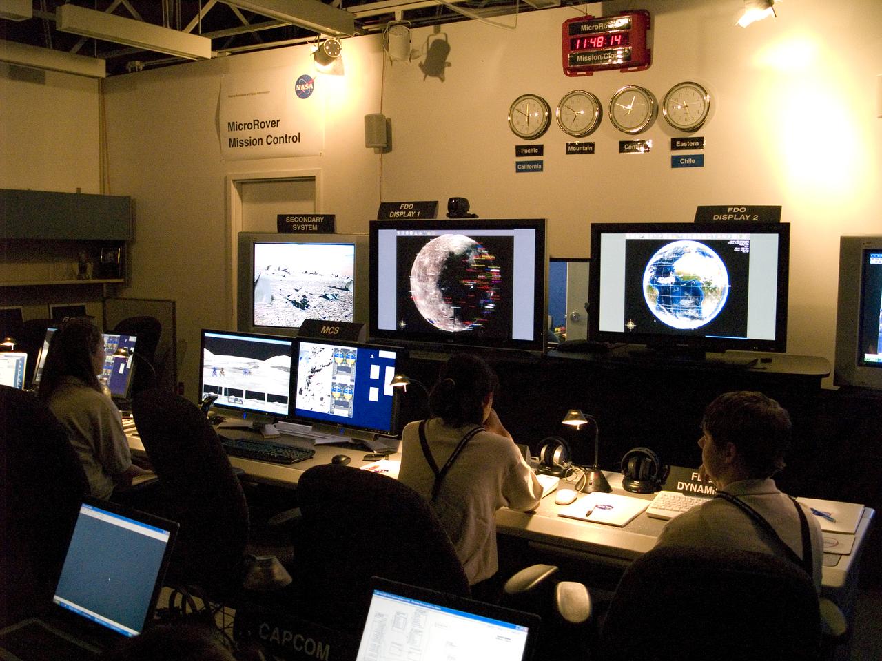 Spaceward Bound Program in Atacama Desert; shown here is a realtime webcast from Yungay, Chile vis satellite involving NASA Scientists and seven NASA Explorer school teachers. On the Ames end we find the Girl Scouts Space cookines robotic team. The robot nicknamed Zoe is looking for life in extreme environments in preparation for what might be encounter on Mars. see full text on the NASA-Ames News - Research # 04-91AR