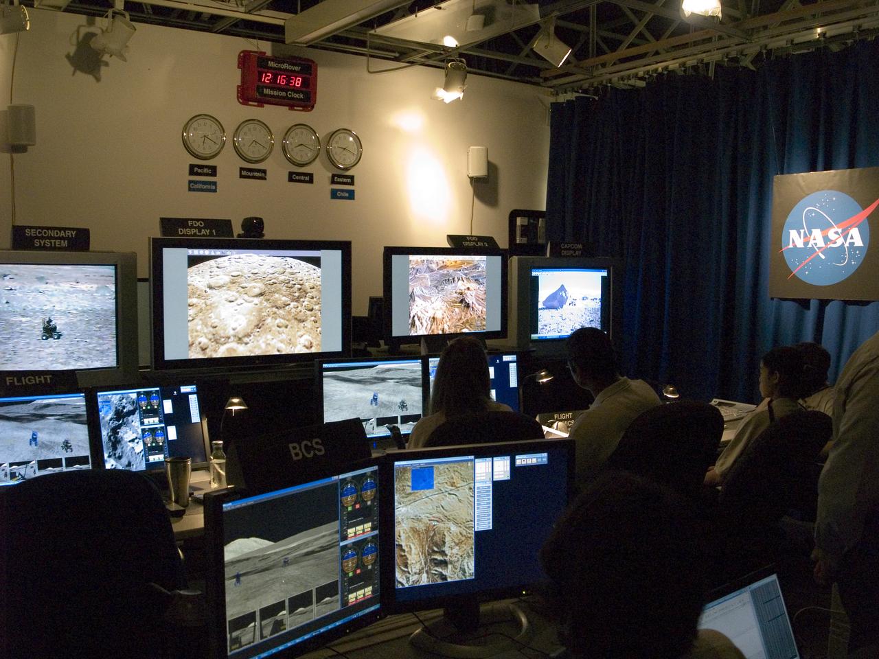 Spaceward Bound Program in Atacama Desert; shown here is a realtime webcast from Yungay, Chile vis satellite involving NASA Scientists and seven NASA Explorer school teachers. On the Ames end we find the Girl Scouts Space cookines robotic team. The robot nicknamed Zoe is looking for life in extreme environments in preparation for what might be encounter on Mars. see full text on the NASA-Ames News - Research # 04-91AR
