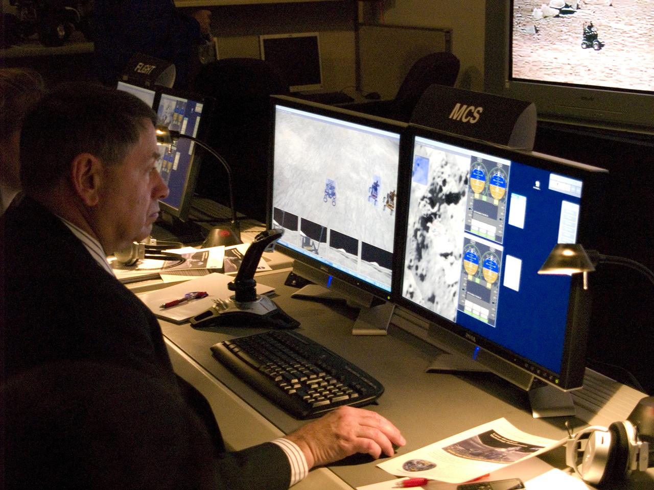 Spaceward Bound Program in Atacama Desert; shown here is a realtime webcast from Yungay, Chile vis satellite involving NASA Scientists and seven NASA Explorer school teachers. Spaceward Bound Program in Atacama Desert; shown here is a realtime webcast from Yungay, Chile vis satellite involving NASA Scientists and seven NASA Explorer school teachers. On the Ames end we find the Girl Scouts Space cookines robotic team. The robot nicknamed Zoe is looking for life in extreme environments in preparation for what might be encounter on Mars. On the Ames end we find the Girl Csouts Space cookines robotic team. The robot nicknamed Zoe is looking for life in extreme environments in preparation for what might be encounter on Mars.  see full text on the NASA-Ames News - Research # 04-91AR  Center Director works with 'SpaceCookie' sending commands to Zoe.