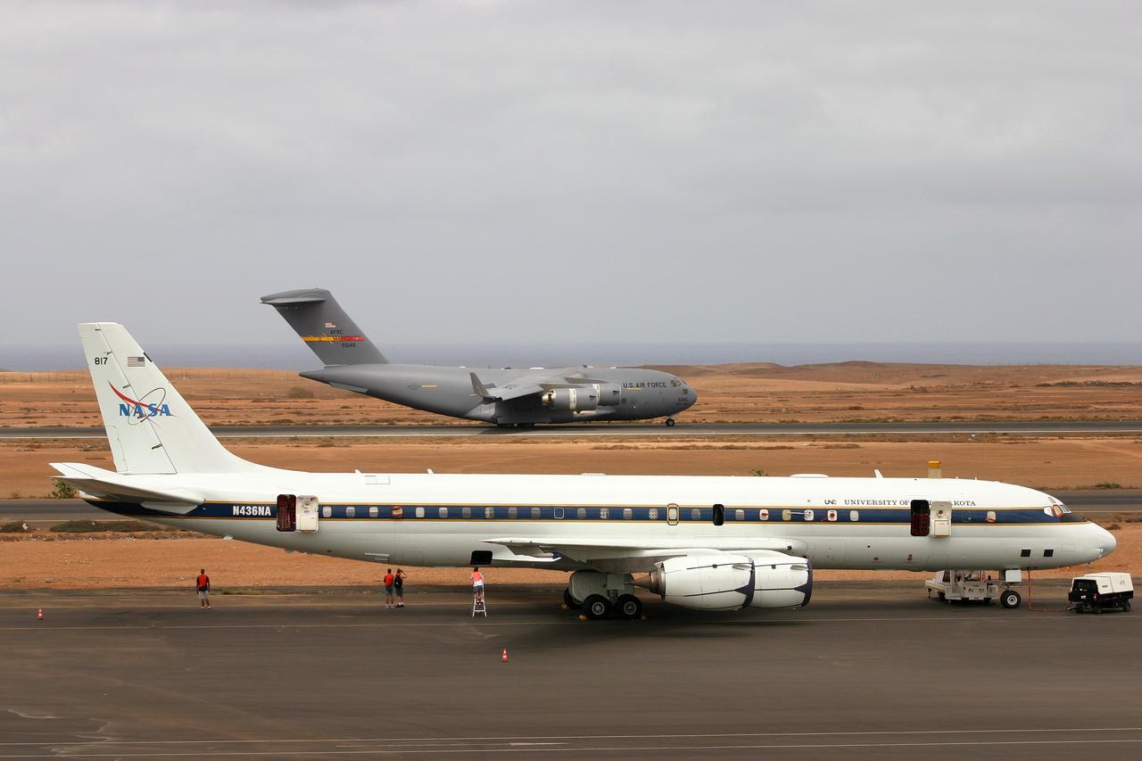 DC-8 NAMMA MISSION TO CAPE VERDE, AFRICA: U.S. Air Force C-17, Spirit of Ronald Reagan, lands at Sal Island's Amilcar Cabral International Airport carrying equipment and supplies for the mission, NASA DC-8 in foreground.