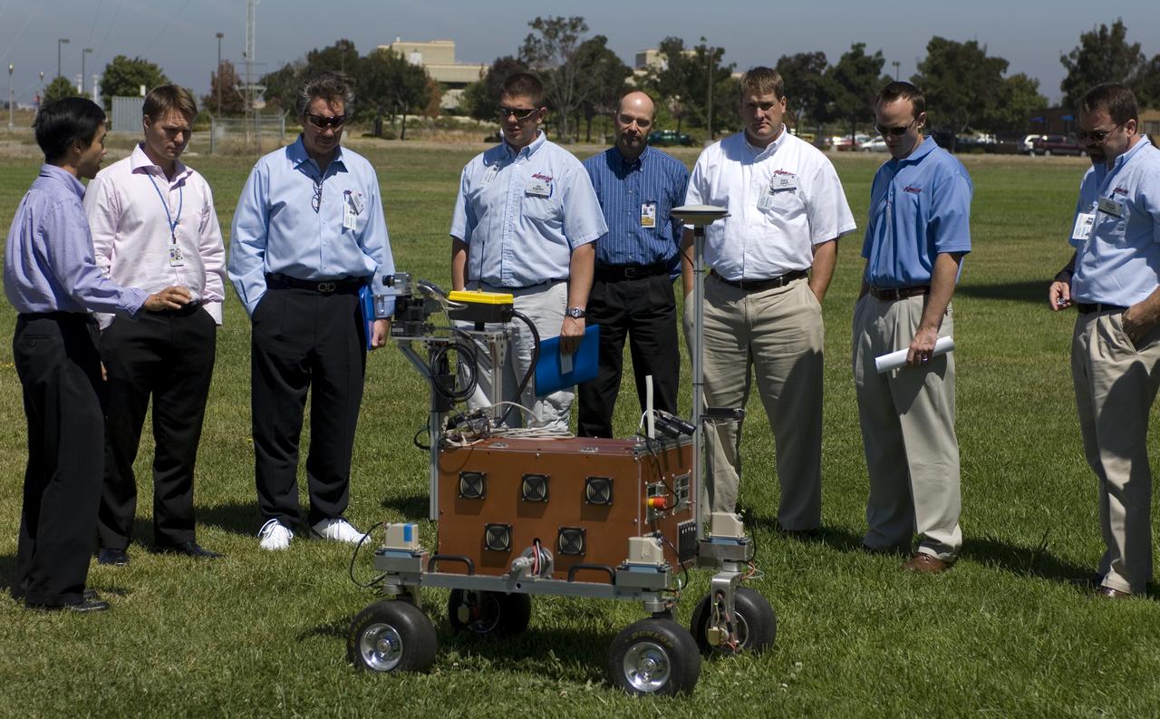 Robert Bigelow gets demonstration of the Ames rover at the Ames Mars Yard. L-R: Terrrence Fong, Robert Schingler (both of Ames) Robert Bigelow, Jay Ingham of NNT, Phil Hearlth, Ames, Gary Jones and ___, of NNT