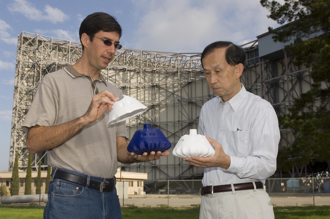 Ian Fernandez and Hiro Miur with composite CEV Model (NESC Composite Crew Module Design