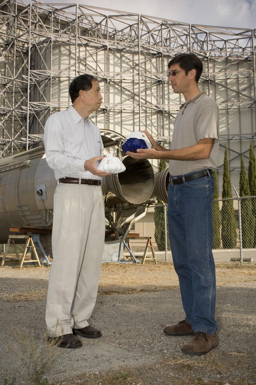 Ian Fernandez and Hiro Miur with composite CEV Model (NESC Composite Crew Module Design
