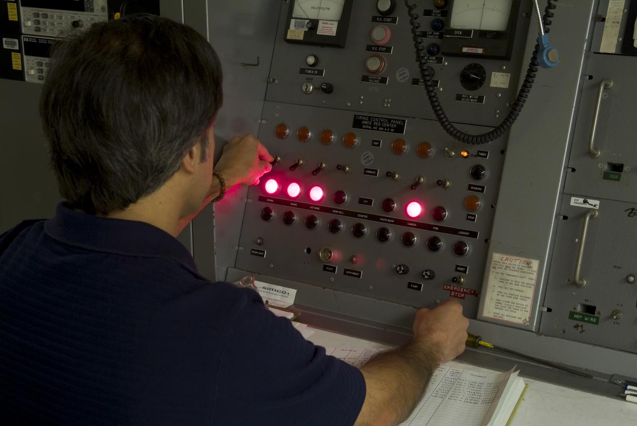 CEV (Crew Escape Vehicle) capsule Balistic Range testing to examine static and dynamic stability characteristics  (at the Hypervelocity Free-Flight Facility) HFF Chuck Cornelison operating 'Firing' control pannel