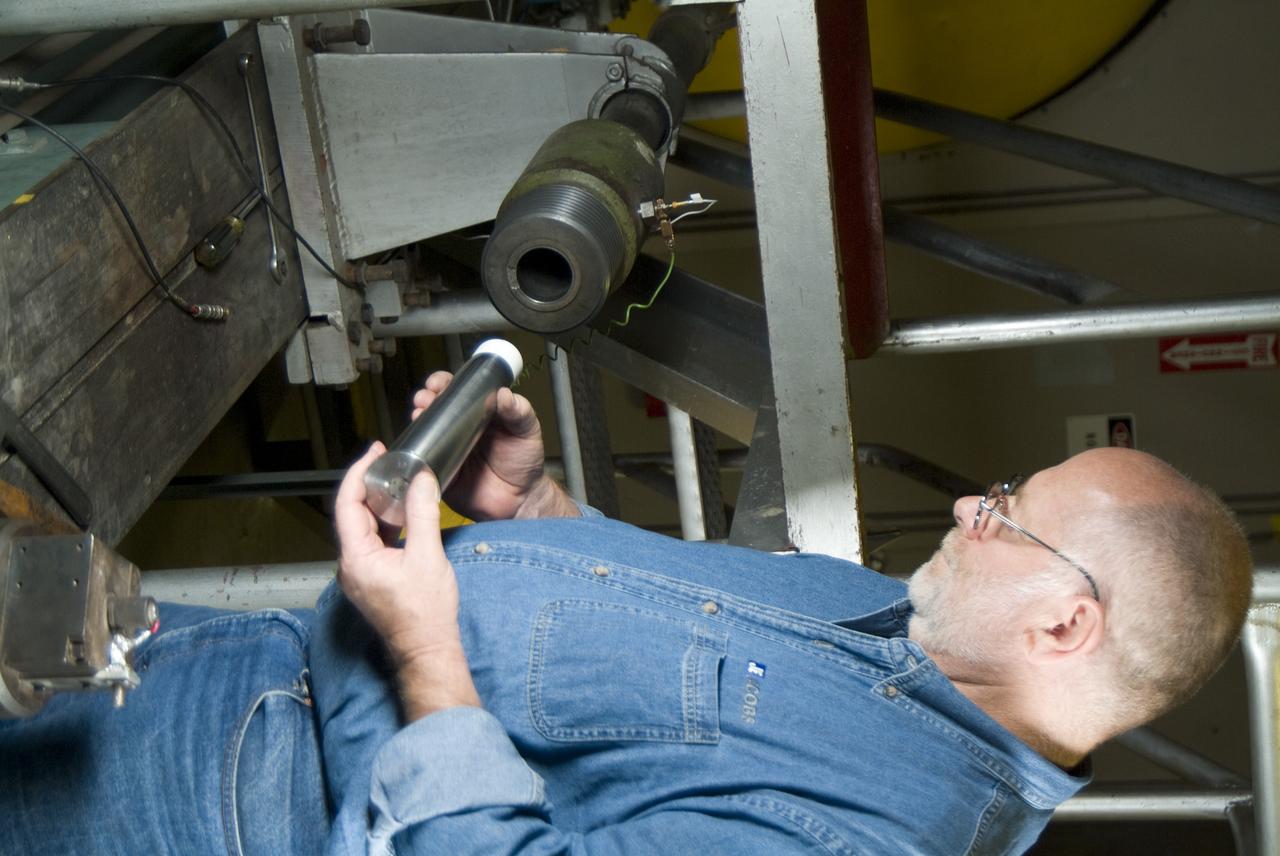 CEV (Crew Escape Vehicle) capsule Balistic Range testing to examine static and dynamic stability characteristics  (at the Hypervelocity Free-Flight Facility) HFF - Don Holt installing projectile & powder charge