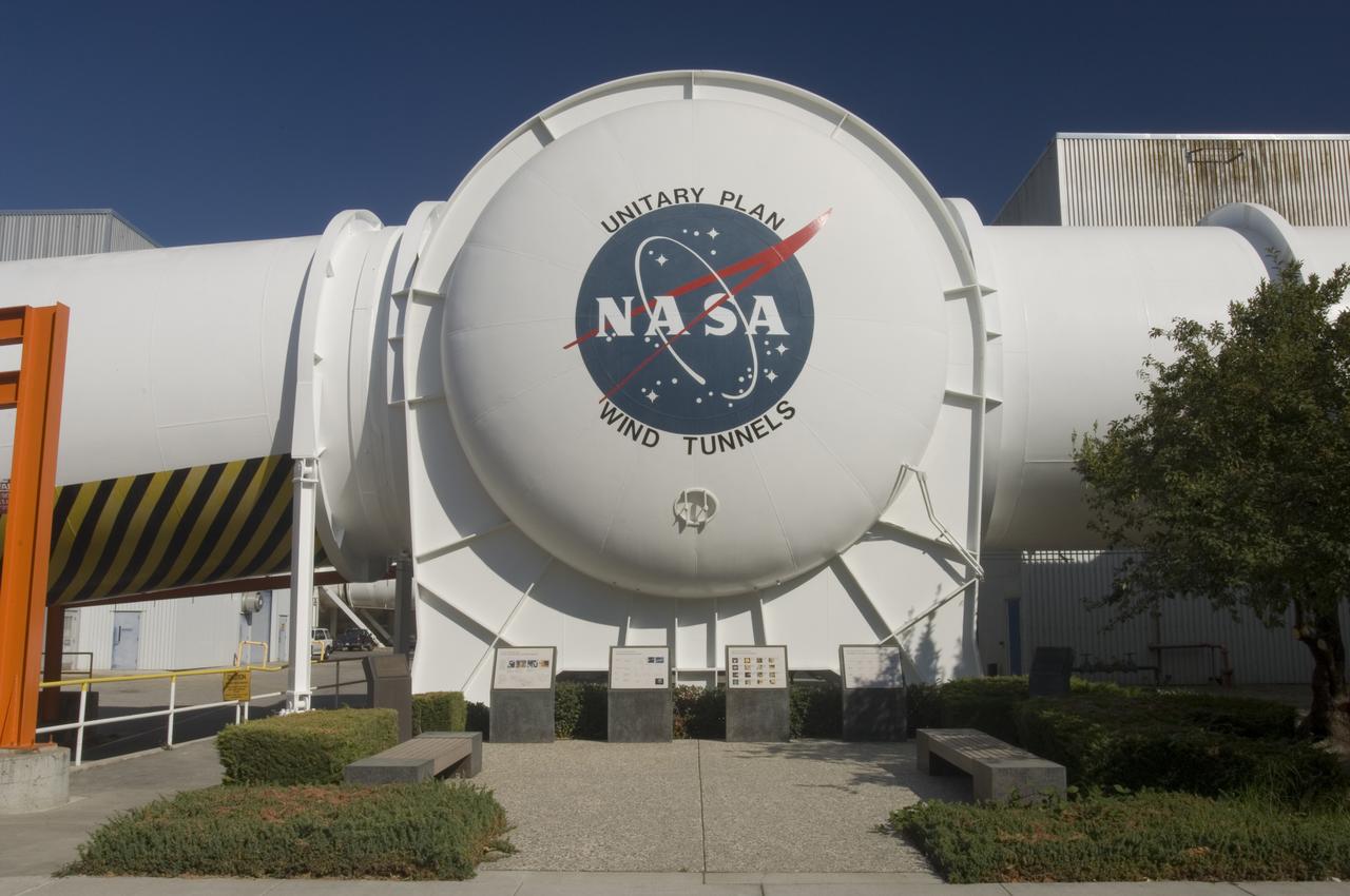 Ames and Moffett Field (MFA) historical sites and memorials Unitary Plan Wind Tunned plaza; display and historical site plaques with the NASA logo on the Wind Tunnel valve as a backdrop.