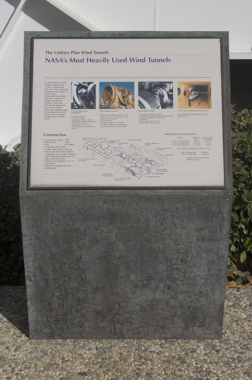 Ames and Moffett Field (MFA) historical sites and memorials Unitary Plan Wind Tunned plaza; display and historical site plaques with the NASA logo on the Wind Tunnel valve as a backdrop.