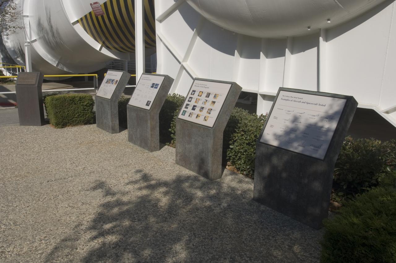 Ames and Moffett Field (MFA) historical sites and memorials Unitary Plan Wind Tunned plaza; display and historical site plaques with the NASA logo on the Wind Tunnel valve as a backdrop.