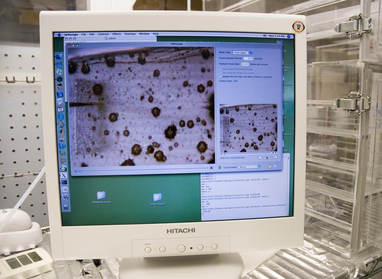 Stardust sample analysis @ UC Berkeley clean room with Dr Scott Sandford, NASA Ames Astrophysicist - mission aerogel samples provided to UC Berkeley for analysis by NASA are shown on computer screen during microscopic sampling