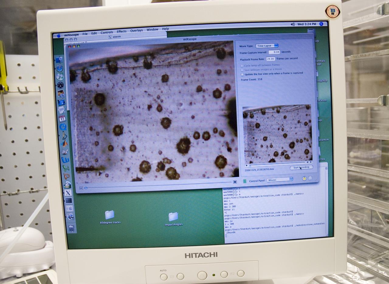 Stardust sample analysis @ UC Berkeley clean room  with Dr Scott Sandford, NASA Ames Astrophysicist - mission aerogel samples provided to UC Berkeley for analysis by NASA are shown on computer screen during microscopic sampling