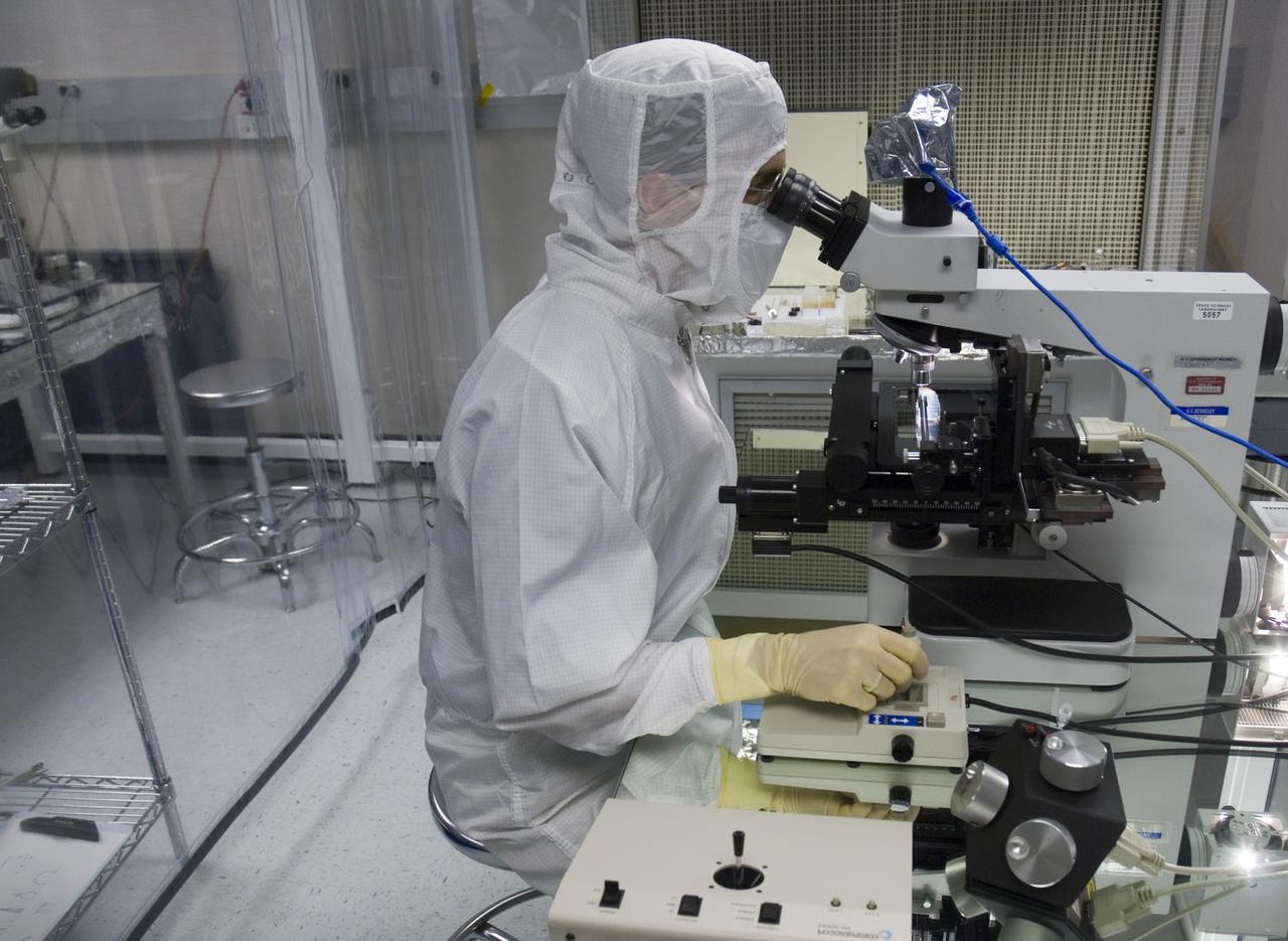 Stardust sample analysis @ UC Berkeley clean room - mission samples provided to UC Berkeley for analysis by NASA Berkeley researcher Chris Snead working with sample encased in aerogel