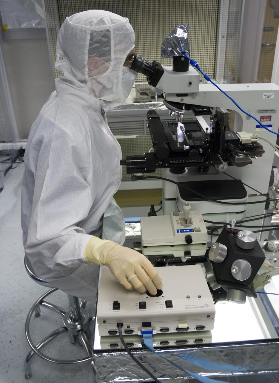 Stardust sample analysis @ UC Berkeley clean room - mission samples provided to UC Berkeley for analysis by NASA Berkeley researcher Chris Snead working with sample encased in aerogel