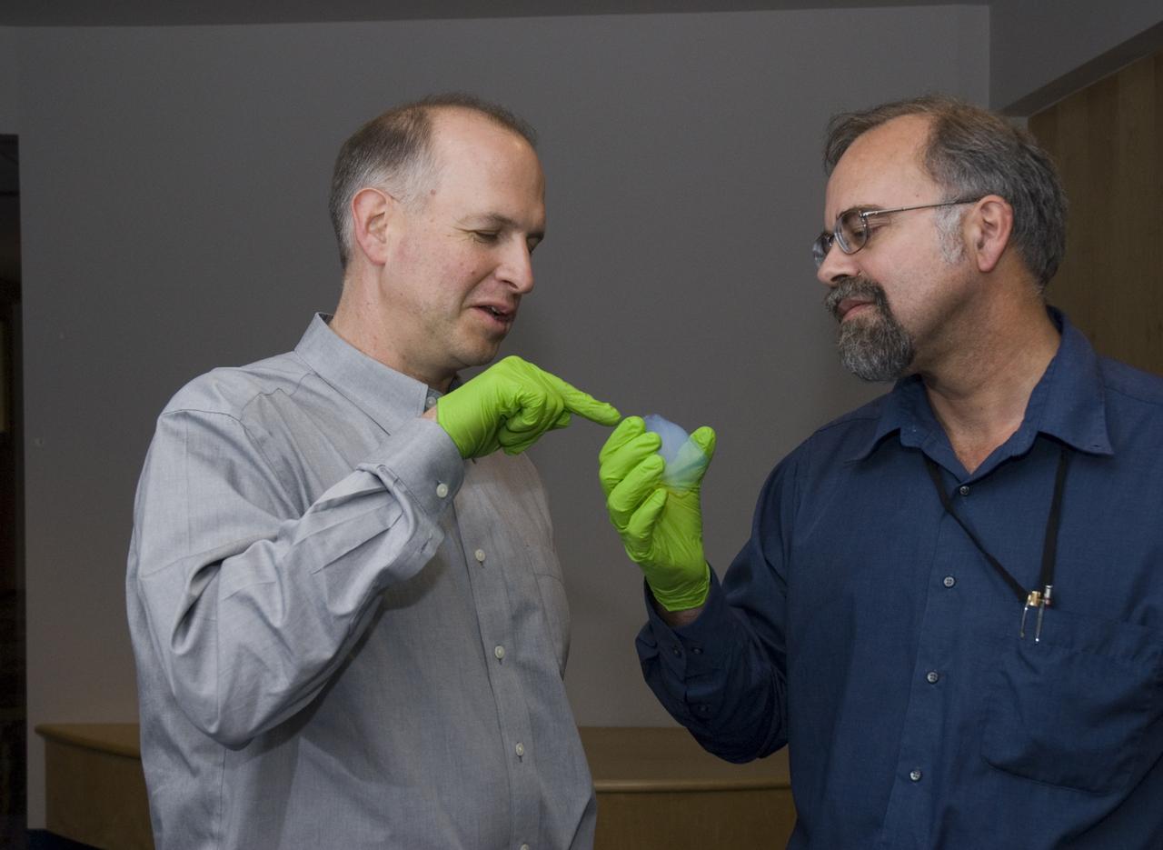 Stardust sample analysis @ UC Berkeley clean room  - mission samples provided to UC Berkeley for analysis by NASA: Dr Andrew Westphal, Berkeley Physicist with Dr Scott Sandford, NASA Ames Astrophysicist holding a (aerogel) sample (Dr Sandford  reports that 'My Colleagues Andrew Westphal, Christopher Snead and Zack Gainsforth have produced over 100 keystones from the Stardust comet aerogel