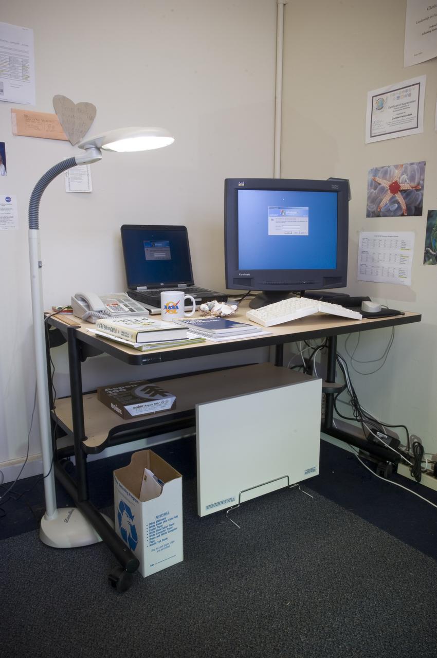 2007 Sustainability report: - Christel Van Arsdale's green office in N-218 with LCD computer monitor, a radiant heating panel, recycling bin, recycled content paper and notebooks, fluorescent lights