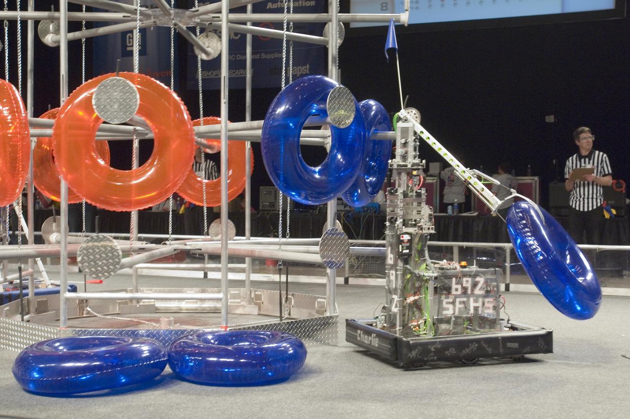 Silicon Valley FIRST Regional Robotics competition:   The Fembots Team 692 - CyboSoft/PASCO Scientific/The Stewart Family/MR Pickles & St Francis High School, Sacramento, California (CA) on the floor doing battle