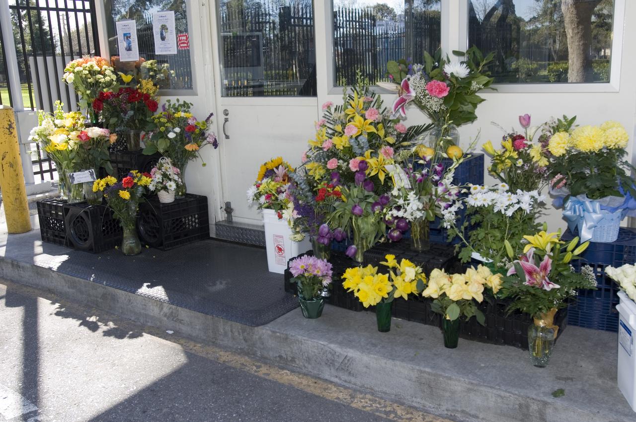 Memorial services for Ames Security Guard Johnny Green. Ames staff members set up a flower memorials at the guard shacks Johnny staffed