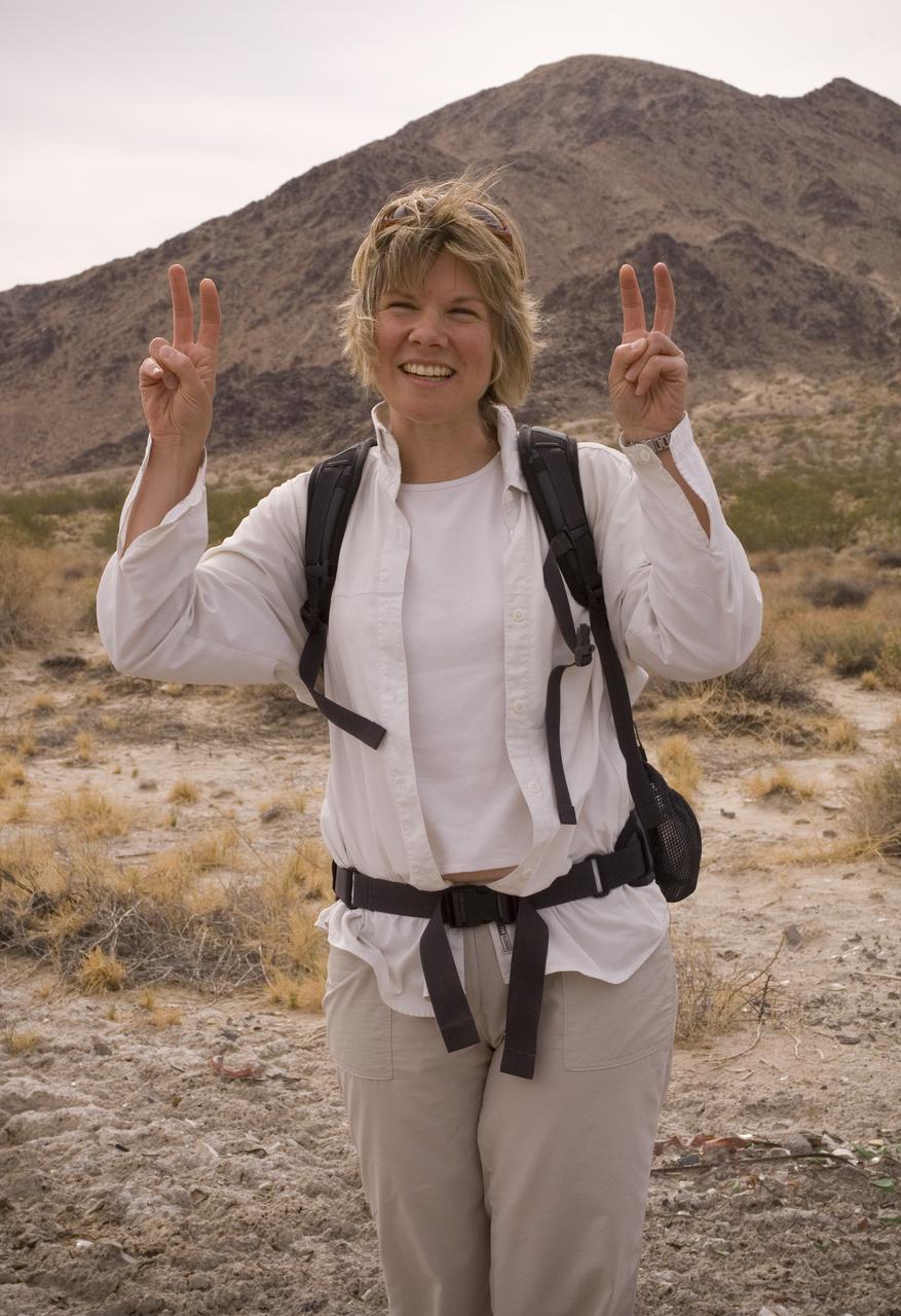 Spaceward Bound event in the Mojave Deser , CA (an outreach exercise) with Dr Chris McKay and Ames Education department personnel Brian Day, Barbara Bazar and a accompaning  (learning for the the classroom)  team of teachers will be studying side-by-side with NASA scientists who search for life in extreme environments, closely approximating what they expect to find on other planets. Why the Mojave -- an inhospitable, sun-drenched spot in the California Desert? This natural setting presents scientists with opportunities to study environments that are analogous to what explorers will find on the Moon and Mars. Teachers and scientists will perform scientific fieldwork in lunar geology, Mars astrobiology, Mars geology, and issues of temperature and solar inundation and radiation. for additional information and Outreach projects  see http://quest.arc.nasa.gov/ shown here: Monika Kress, Professor of Astronomy at San Jose State University