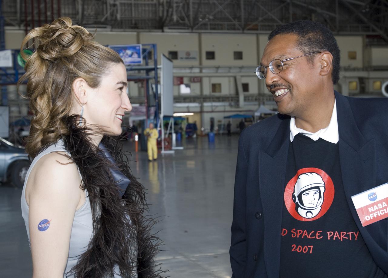 Yuri's Night at Ames a celebration of the first human in space (Lou Braxton III talks with volunteer)