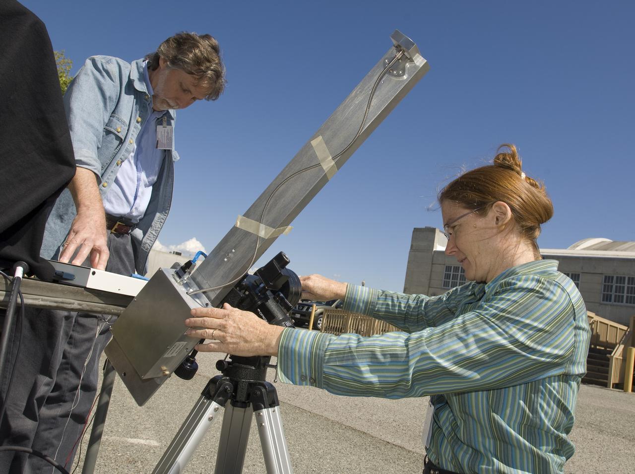 Lunar CRater Observation and Sensing Satellite (LCROSS) and P.I. at NASA Ames Research Center - Calibration of Polychromix Near Infra Red Spectrometer outside n-240 (EEL) with (l) Dan Lynch and (r) Diane Wooden