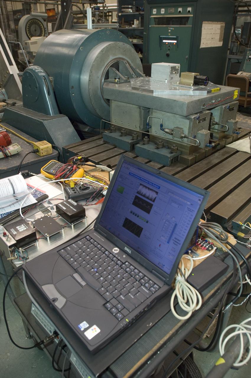 Lunar CRater Observation and Sensing Satellite (LCROSS) and P.I. at NASA Ames Research Center - shake table testing of the Total Luminance Photometer in the EEL lab N-2444. Data analyzer in foreground. (overview)