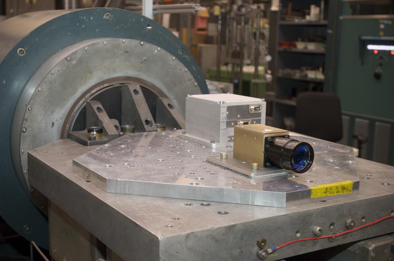 Lunar CRater Observation and Sensing Satellite (LCROSS) and P.I. at NASA Ames Research Center - close up of Total Luminance Photometer lens and electronics units on shake table in N-2444 EEL Laboratory