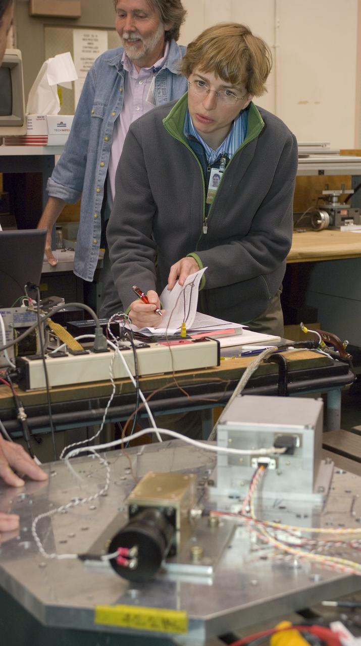 Lunar CRater Observation and Sensing Satellite (LCROSS) and P.I. at NASA Ames Research Center - Total Luminance Photometer shake test in N-244 EEL Laboratory; Kim Ennico takes notes on test set up