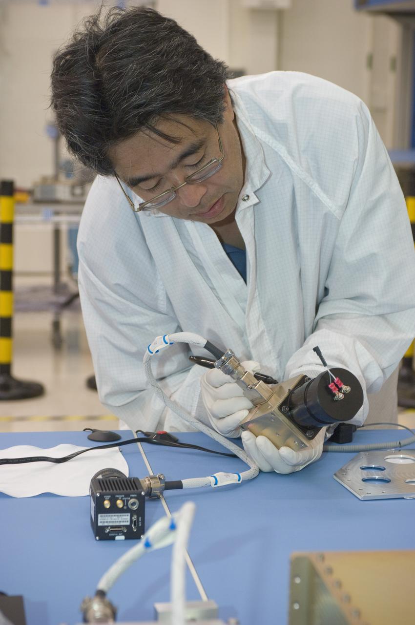LCROSS flight hardware in clean room at Ames N-240. with P.I.'s and EEL personnel preforming various tests with Glen Sasaki