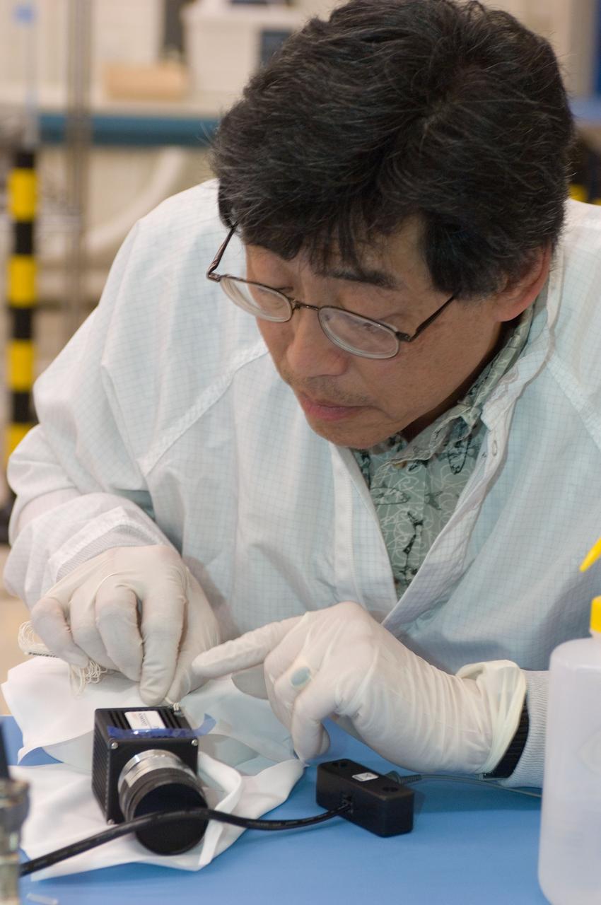 LCROSS flight hardware in clean room at Ames N-240. EEL personnel fabricating testing components with Jerry Wang of Ames, Engineering Evaluation lab