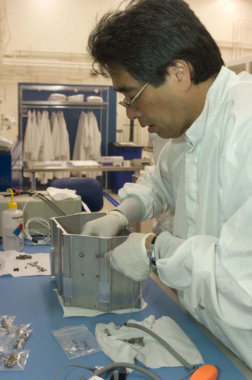 LCROSS flight hardware in clean room at Ames N-240. EEL personnel fabricating & assembling components with Glen Sasaki  of Ames, Engineering Evaluation lab