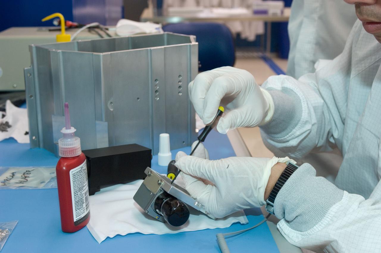 LCROSS flight hardware in clean room at Ames N-240. EEL personnel fabricating & assembling components with Glen Sasaki  of Ames, Engineering Evaluation lab