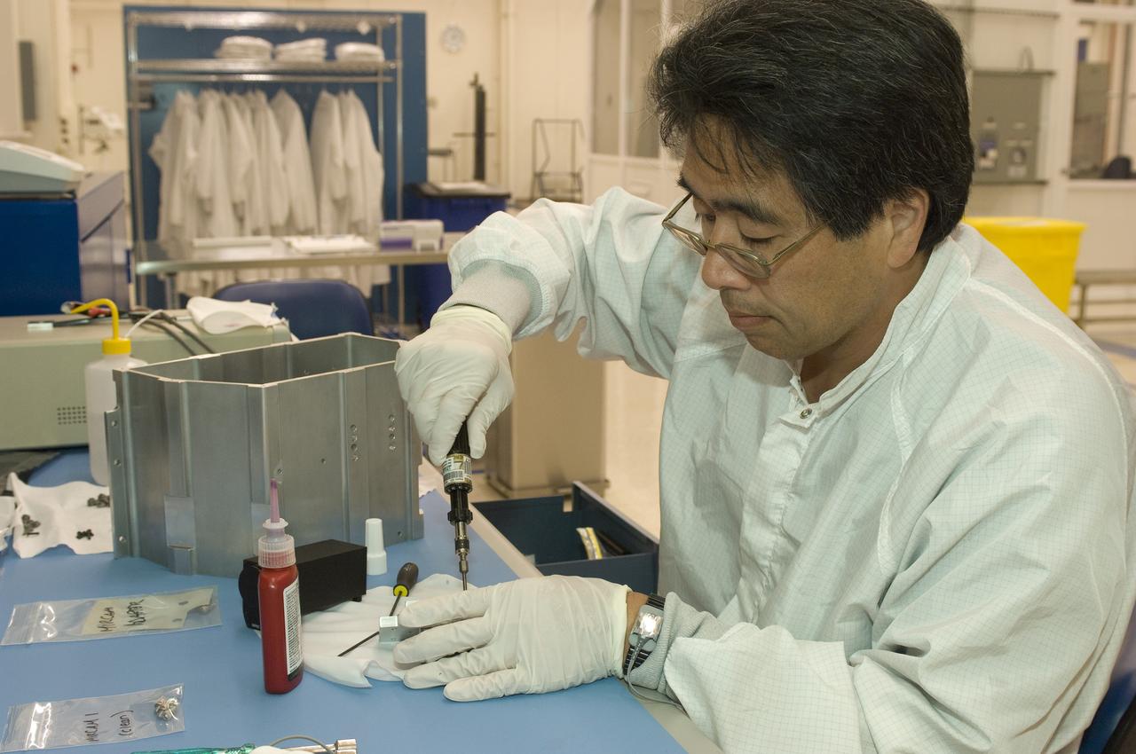 LCROSS flight hardware in clean room at Ames N-240. EEL personnel fabricating & assembling components with Glen Sasaki  of Ames, Engineering Evaluation lab