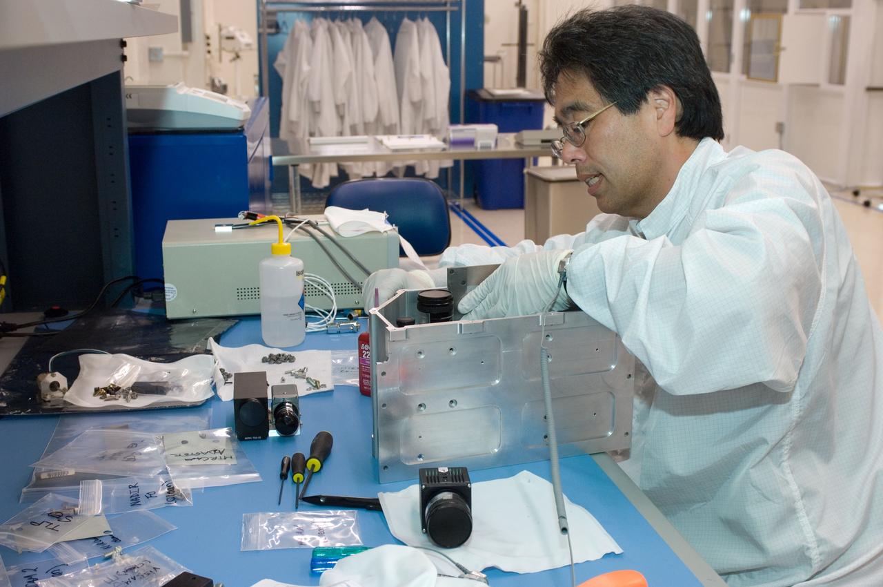 LCROSS flight hardware in clean room at Ames N-240. EEL personnel fabricating & assembling components with Glen Sasaki  of Ames, Engineering Evaluation lab