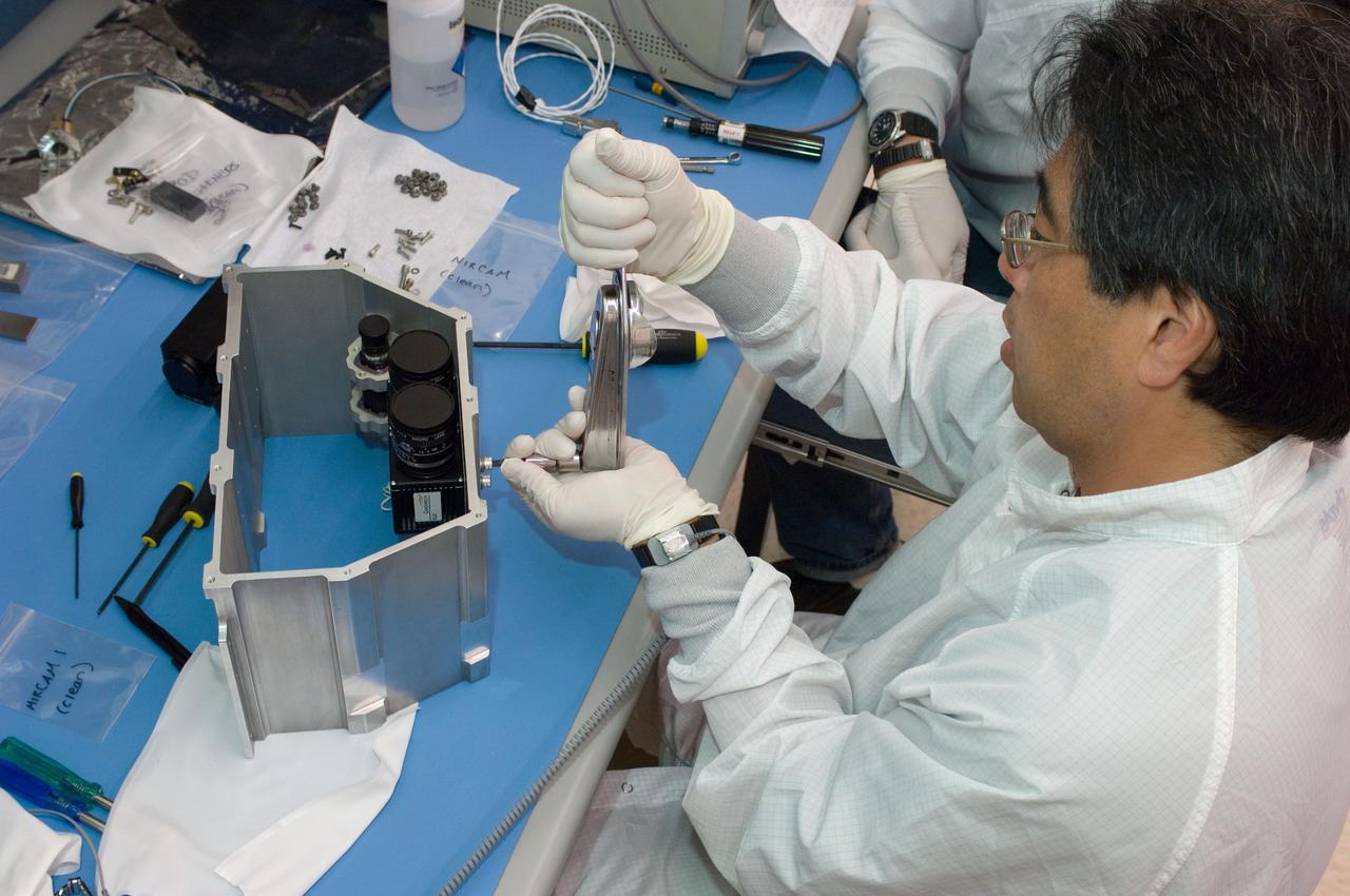 LCROSS flight hardware in clean room at Ames N-240. EEL personnel fabricating & assembling components with Glen Sasaki  of Ames, Engineering Evaluation lab