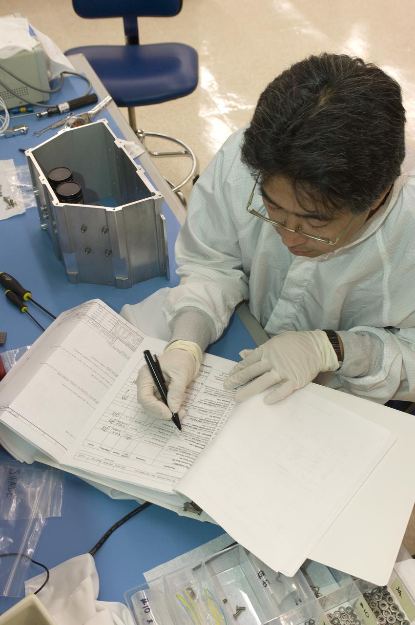 LCROSS flight hardware in clean room at Ames N-240. EEL personnel fabricating & assembling components with Glen Sasaki  of Ames, Engineering Evaluation lab