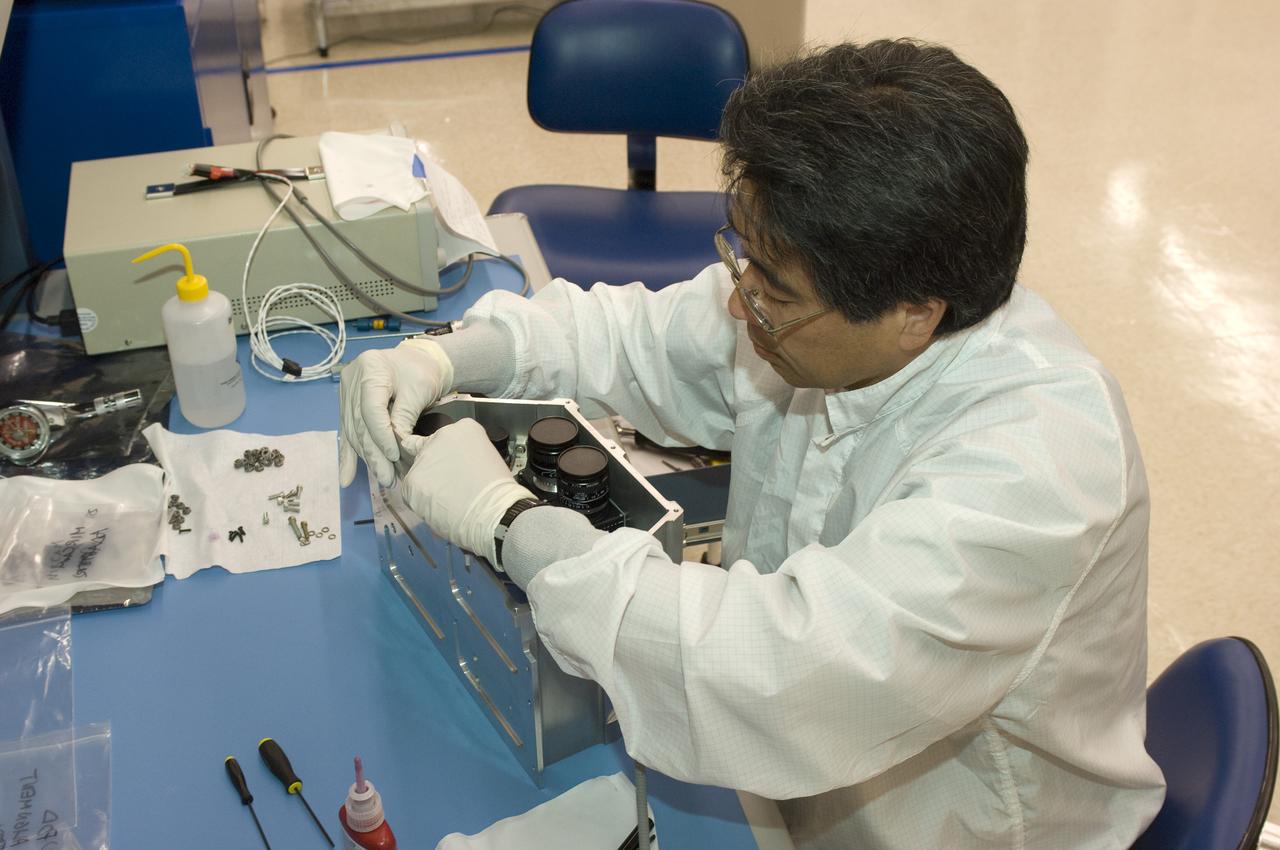 LCROSS flight hardware in clean room at Ames N-240. EEL personnel fabricating & assembling components with Glen Sasaki  of Ames, Engineering Evaluation lab