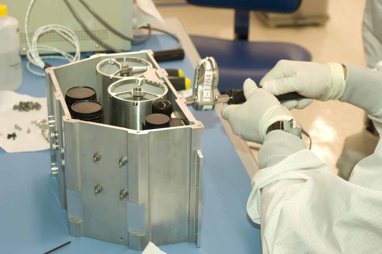 LCROSS flight hardware in clean room at Ames N-240. EEL personnel fabricating & assembling components with Glen Sasaki  of Ames, Engineering Evaluation lab