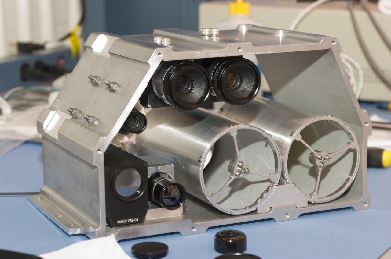 LCROSS flight hardware in clean room at Ames N-240. EEL personnel fabricating & assembling components with Glen Sasaki  of Ames, Engineering Evaluation lab
