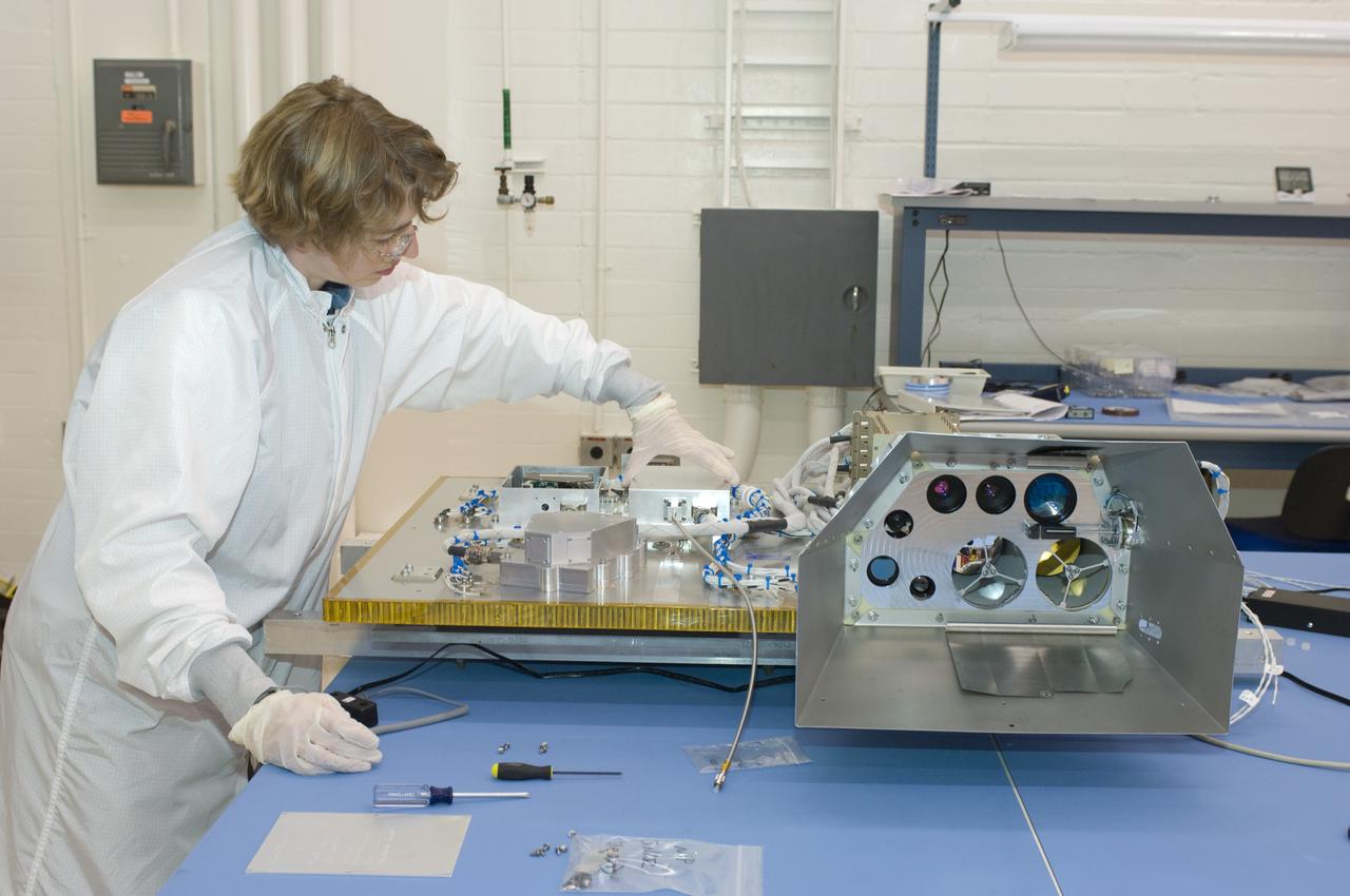 LCROSS flight hardware in clean room at Ames N-240. with P.I. Kim Ennico preforming various tasks