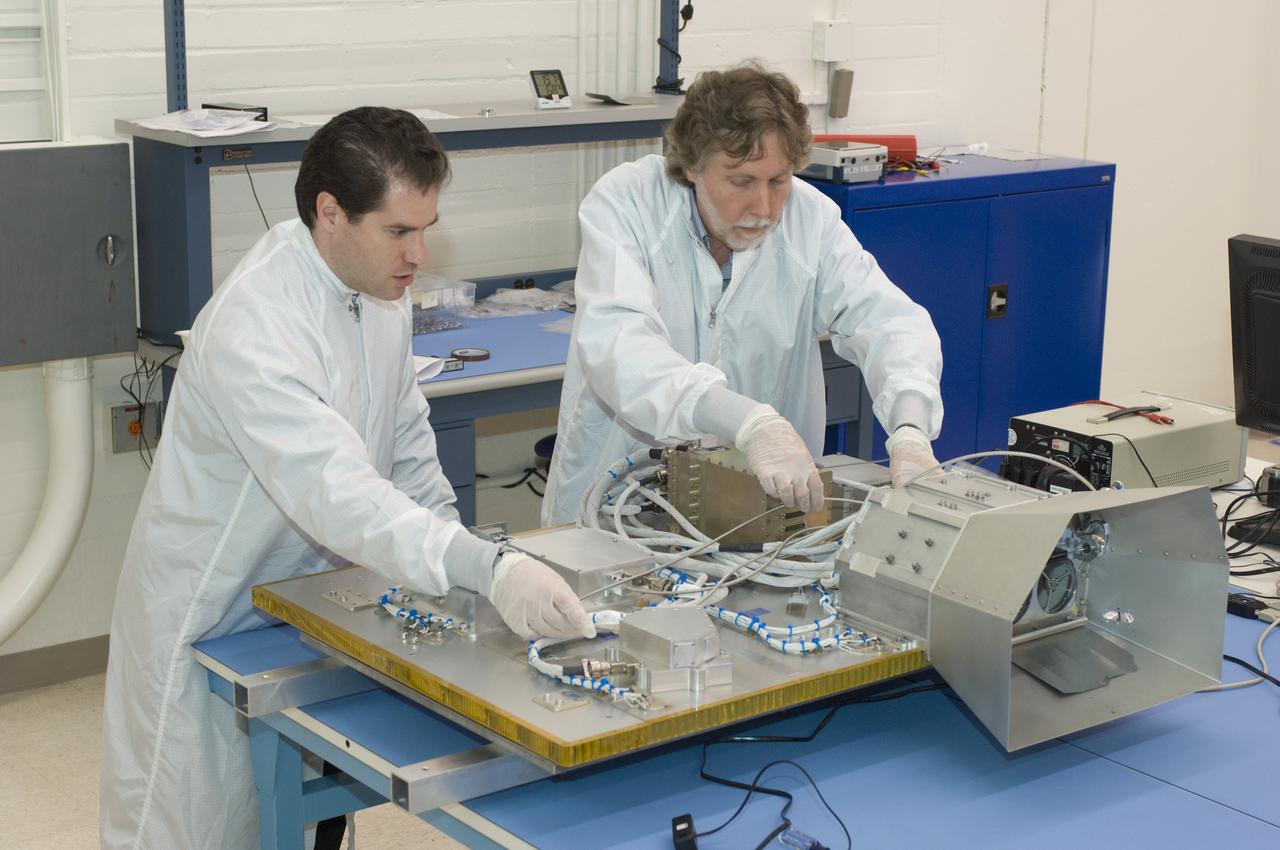 LCROSS flight hardware in clean room at Ames N-240. with P.I.'s  (l - r)  Tony Colaprete and Dana Lynch