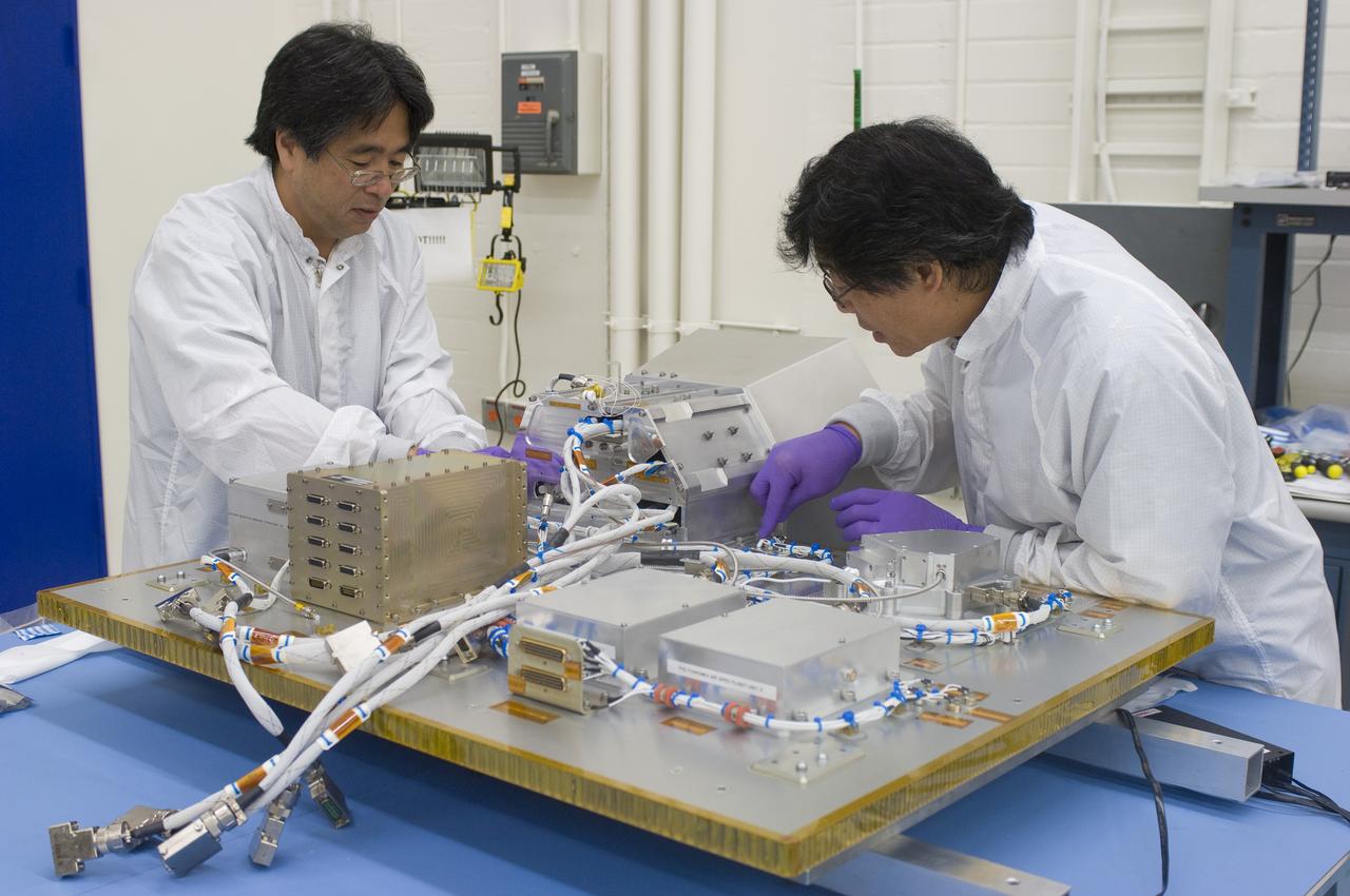 LCROSS in Ames clean room  N-240 - Jerry Wang (L) and Glen Sasaki securing all parts