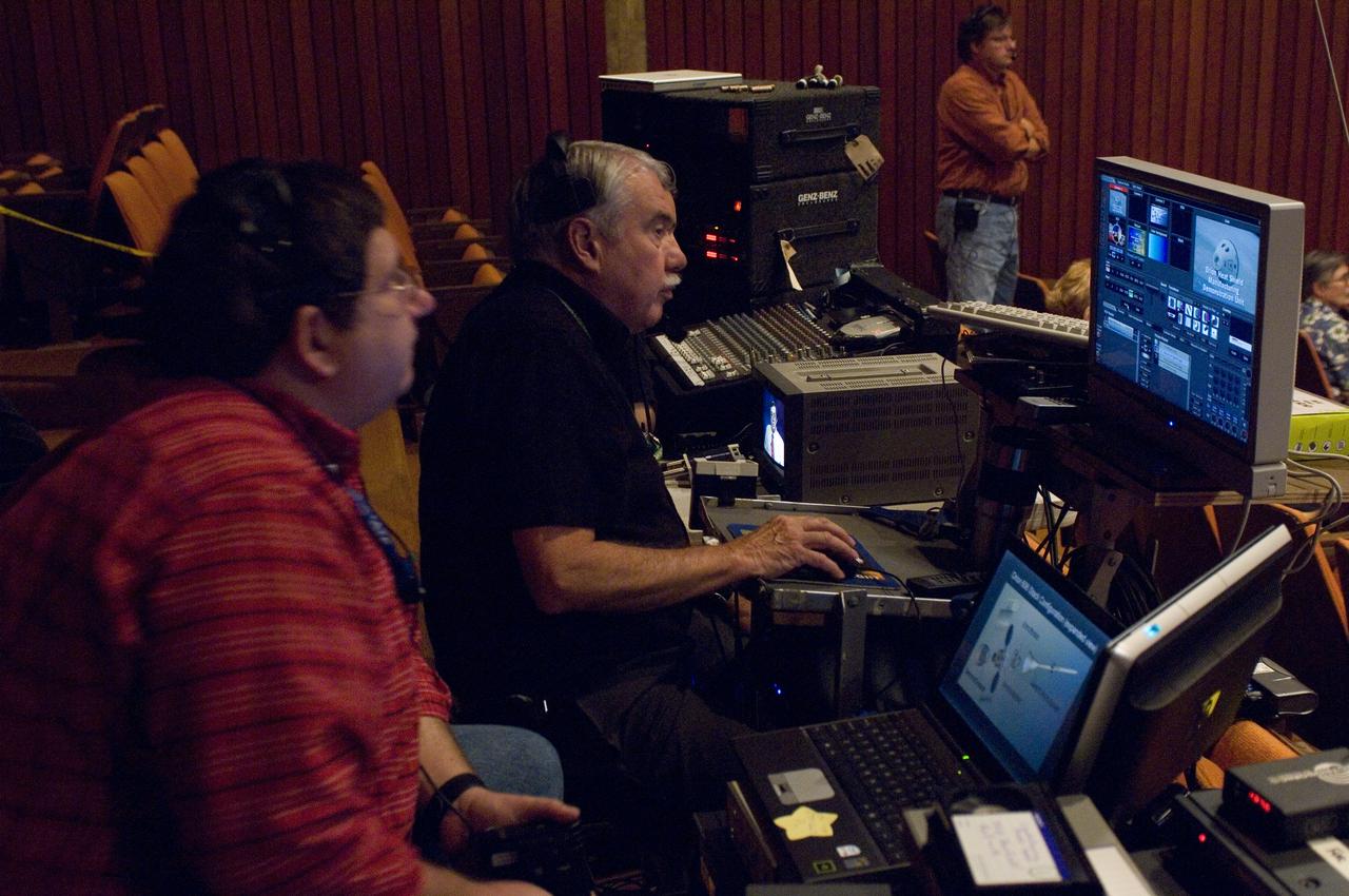 NASA Officials gather at Ames Research Center to discuss Spaceship development progress. Constellation is developing the Orion spacecraft and Ares rockets to support an American return to the moon by 2020. Bill Moede and Jim Taylor, Ames (Planners) Video crew and Ed Schilling, NASA video producer in distance
