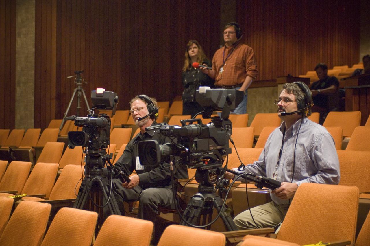 NASA Officials gather at Ames Research Center to discuss Spaceship development progress. Constellation is developing the Orion spacecraft and Ares rockets to support an American return to the moon by 2020. (with front right, Eric James, NASA-EX on camera, Ed Schilling, NASA video producer in distance with Astrid Olson, NASA Ames PAO)