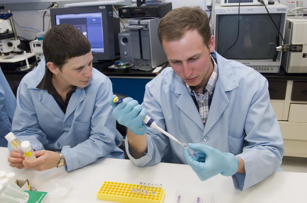 STS-121 PAYLOAD; FIT FRUITFLIES (DORSOPHILA) Post flight with Laura Higgins (r) and Florian Selch (l)