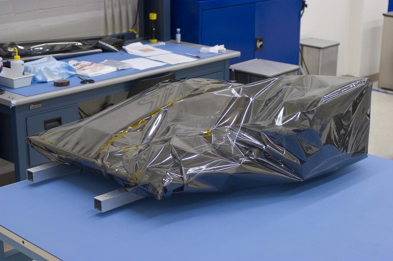 LCROSS in Ames clean room N-240-  wrapped for transfer to Northrup Grumman Redondo Beach, CA where more calibration will be done before finally being sent for mating with the LRO spacecraft