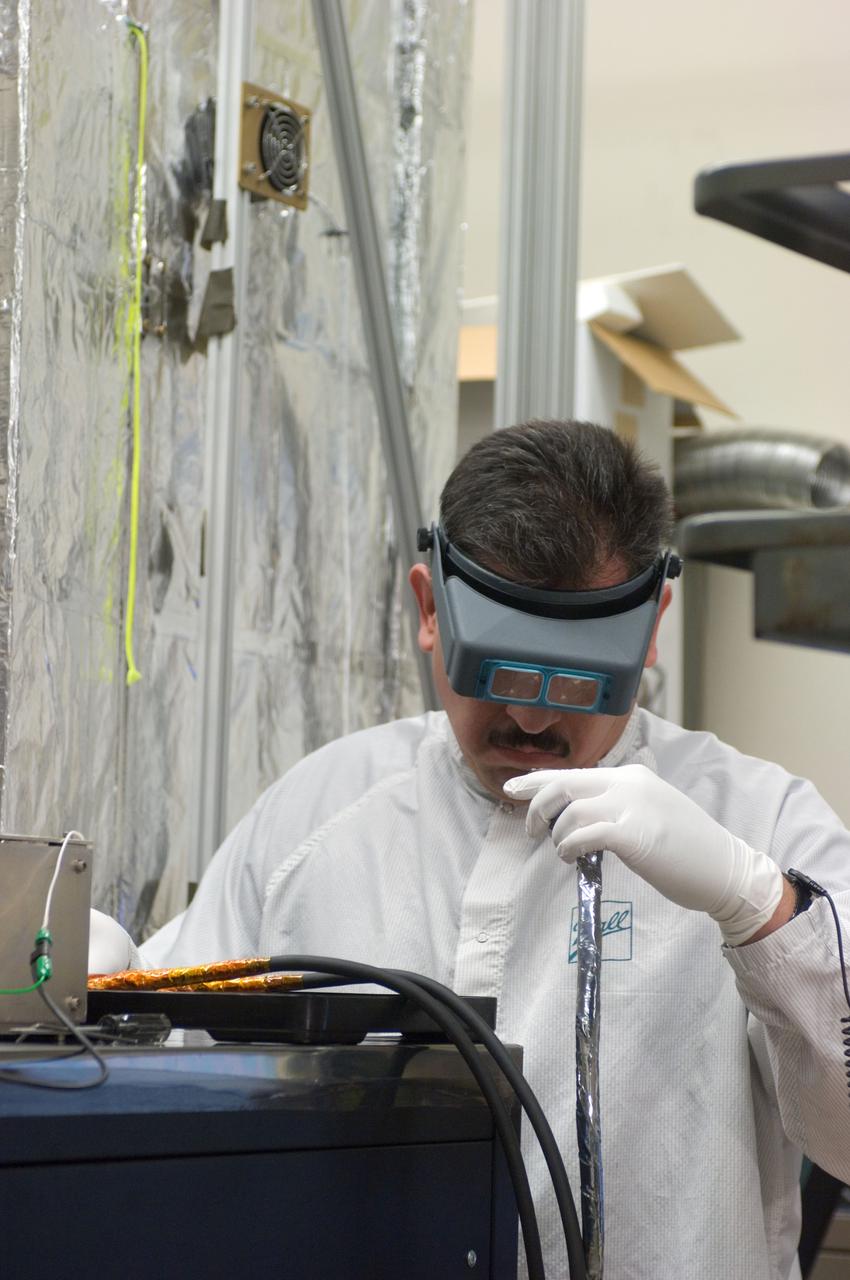 Kepler project; technicians from Ball Aerospace work on  and in the test chamber assembled at Nasa Ames Research center testing components
