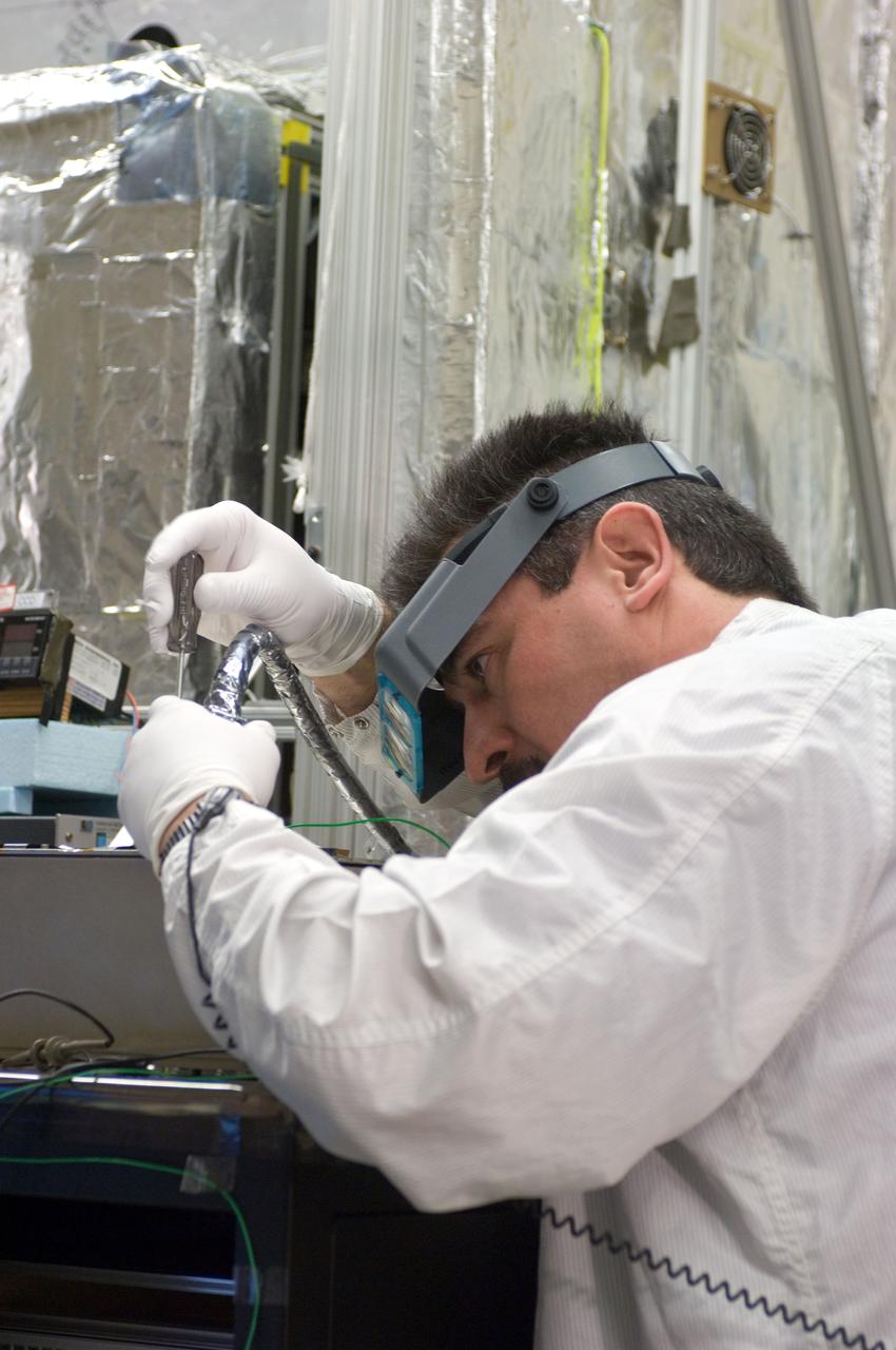 Kepler project; technicians from Ball Aerospace work on  and in the test chamber assembled at Nasa Ames Research center testing components