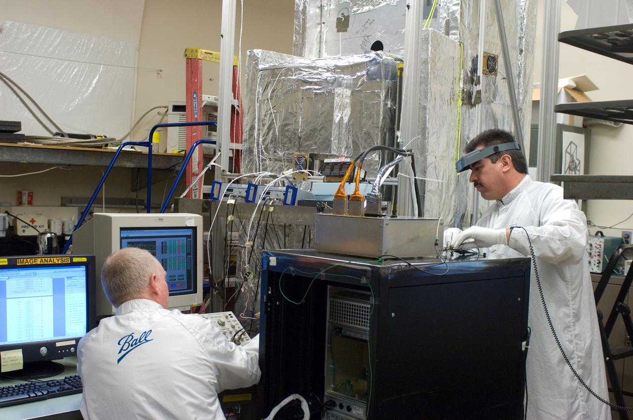 Kepler project; technicians from Ball Aerospace work on  and in the test chamber assembled at Nasa Ames Research center testing components